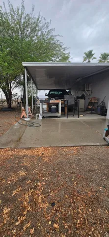 a living room with a large window and furniture