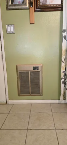 a kitchen with stainless steel appliances granite countertop a stove and a refrigerator