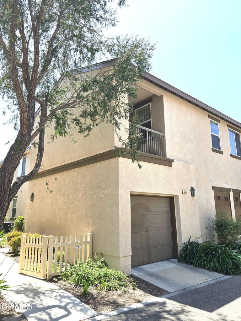 3319 North Ventura Road Oxnard, CA 93036 - Photo 21 of 25 a front view of a house with garden