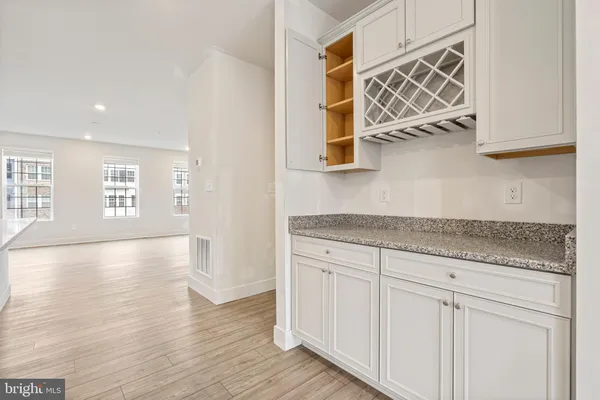 a view of a kitchen cabinets and wooden floor