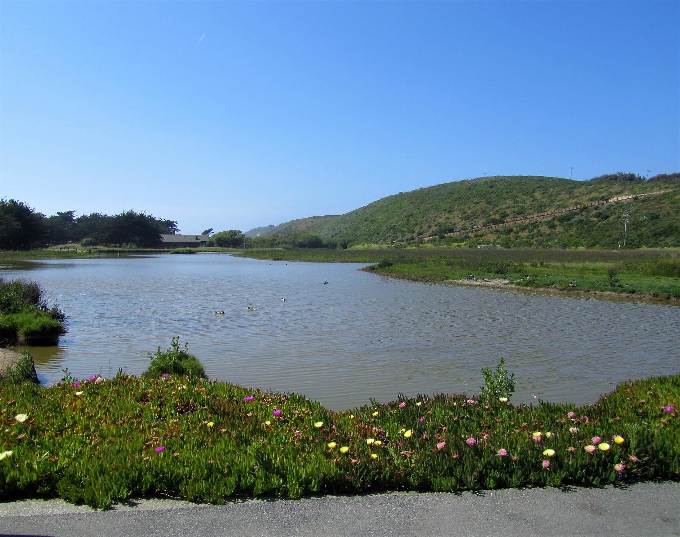 101 Shell Road, Unit 84 Watsonville, CA 95076 - Photo 13 of 40 a view of a lake with a mountain in the background