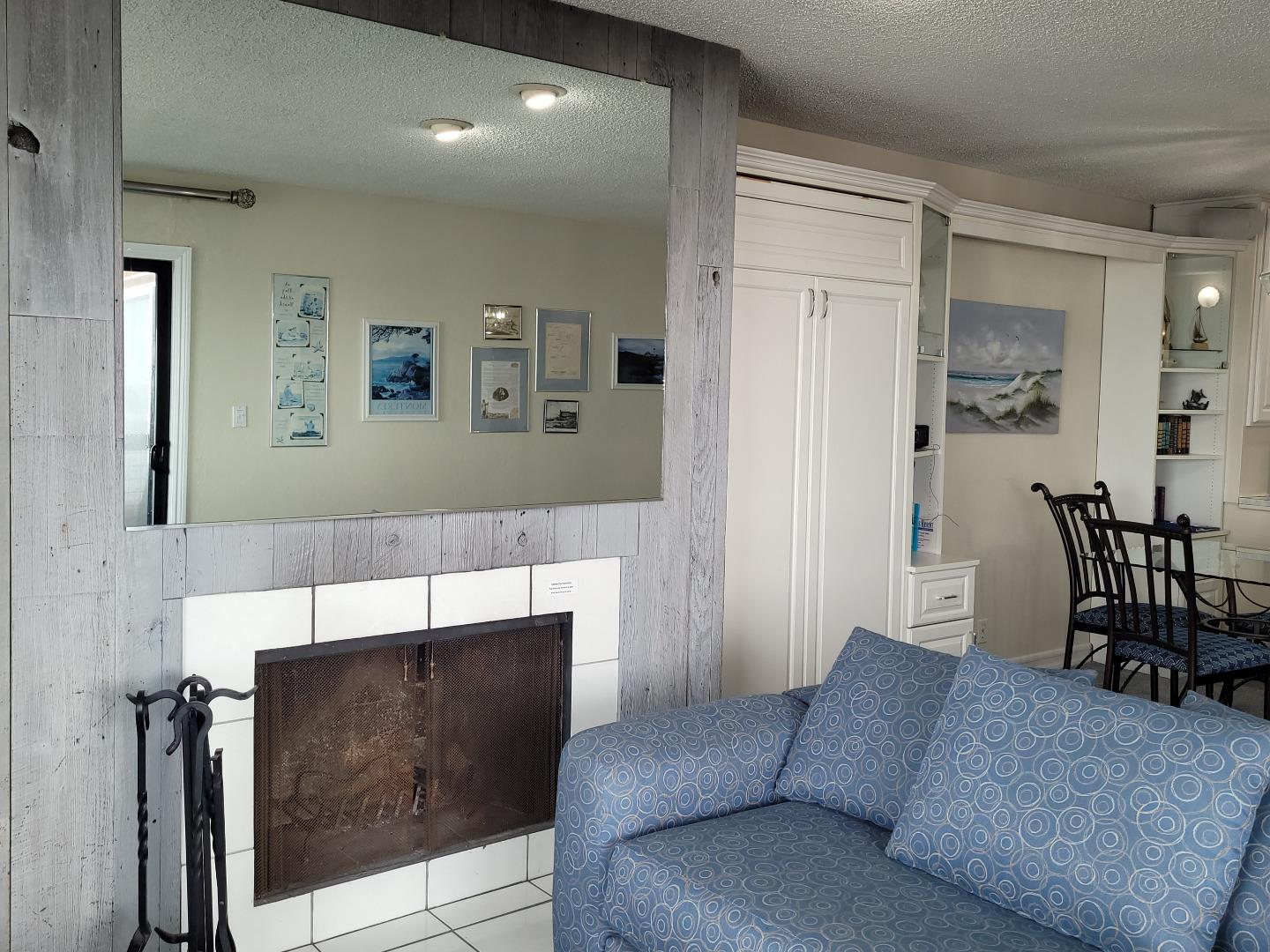 101 Shell Road, Unit 84 Watsonville, CA 95076 - Photo 28 of 40 a living room with furniture and a fireplace