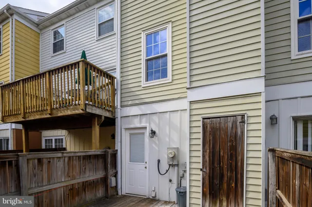a view of a house with wooden deck