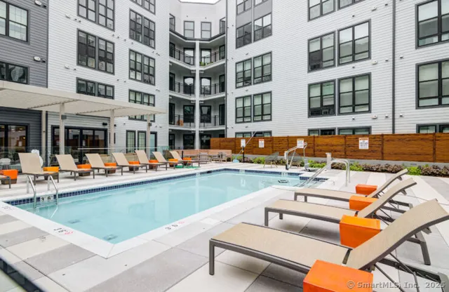 a view of a swimming pool with a lounge chairs