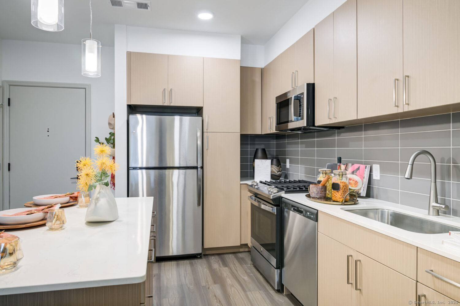 630 Chapel Street, Unit 2BMODEL New Haven, CT 06510 - Photo 33 of 40 a kitchen with stainless steel appliances a sink a refrigerator a stove a microwave and cabinets