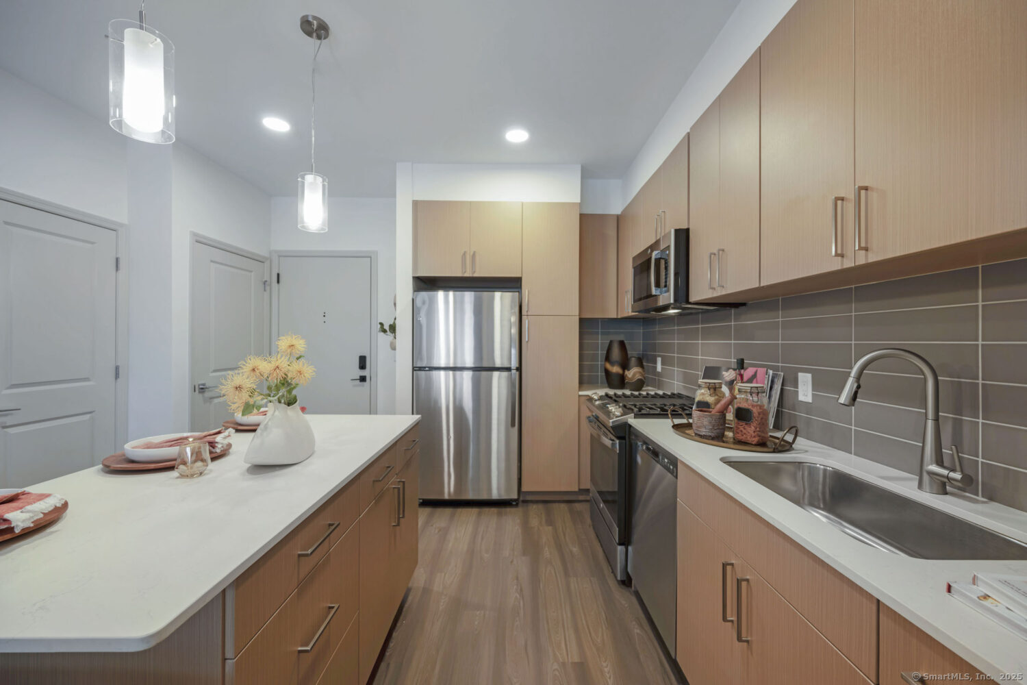 630 Chapel Street, Unit 2BMODEL New Haven, CT 06510 - Photo 34 of 40 a kitchen with kitchen island granite countertop a sink cabinets stainless steel appliances and a counter top space