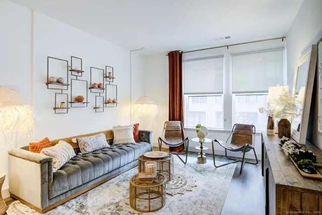 a living room with furniture and a large window