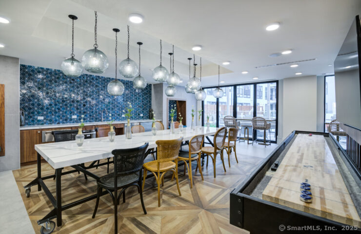 630 Chapel Street, Unit 2BMODEL New Haven, CT 06510 - Photo 5 of 40 a view of a dining area with furniture and a chandelier
