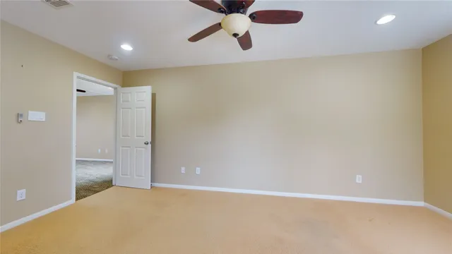 a bathroom with a granite countertop sink a mirror and a bathtub