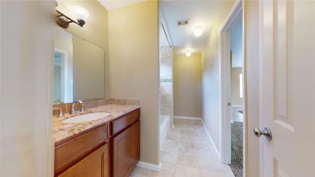 a bathroom with a bathtub and toilet
