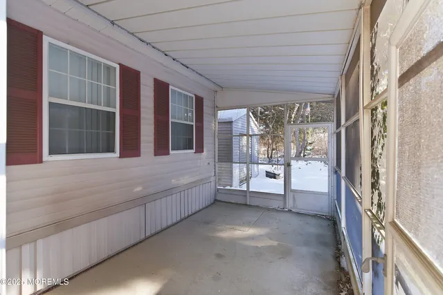 a view of an entryway with a floor to ceiling window
