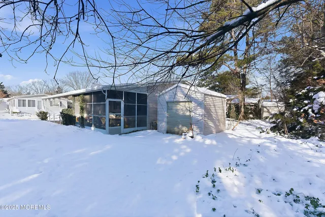 a view of a house with a snow in a yard