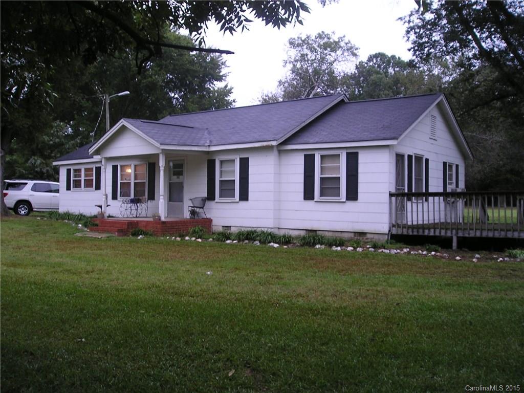 4904 Morgan Mill Road Monroe, NC 28110 - Photo 1 of 24 a front view of a house with a garden and yard