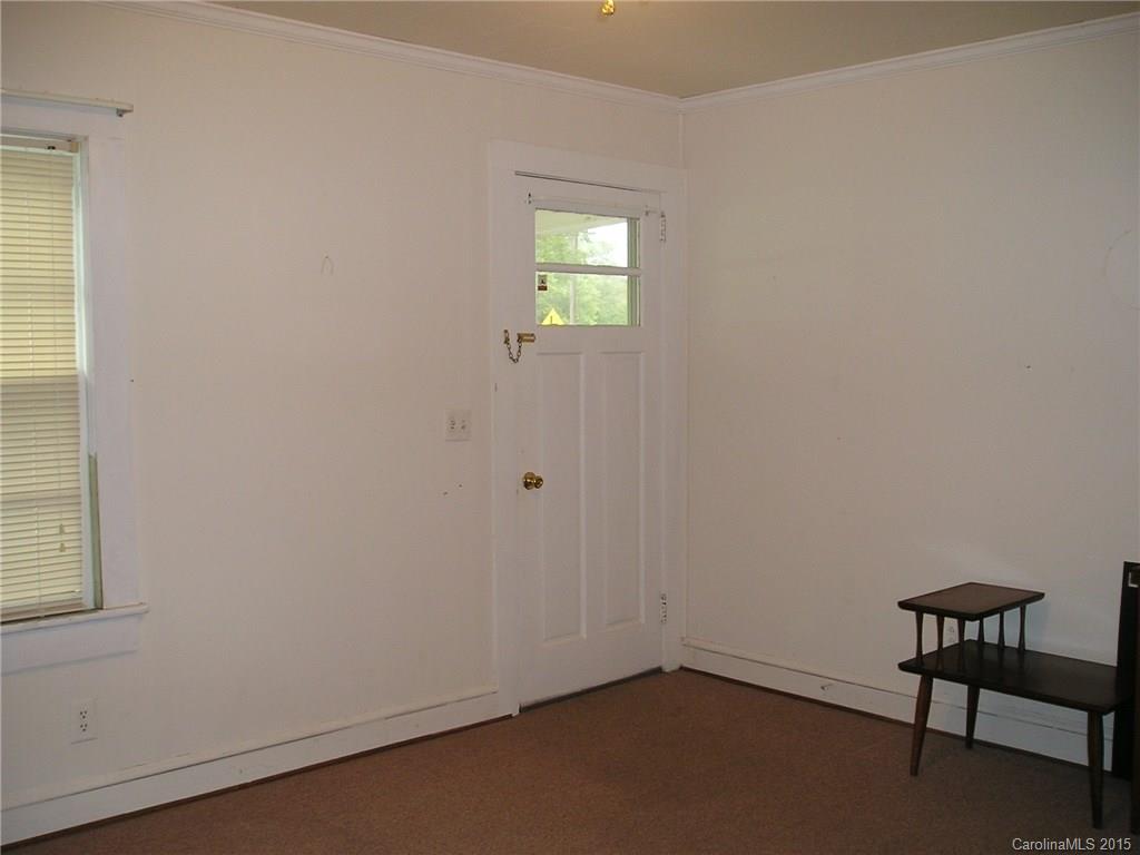 4904 Morgan Mill Road Monroe, NC 28110 - Photo 11 of 24 an empty room with windows and fan