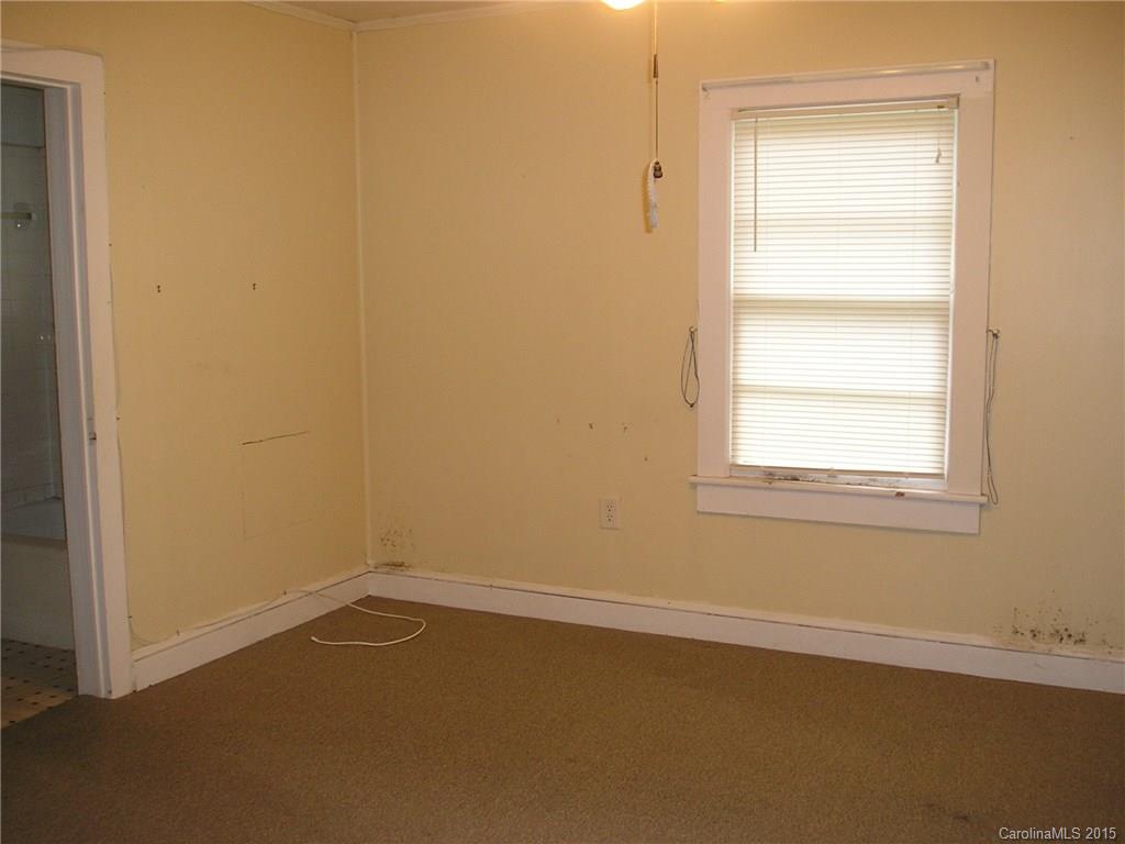 4904 Morgan Mill Road Monroe, NC 28110 - Photo 13 of 24 an empty room with a window