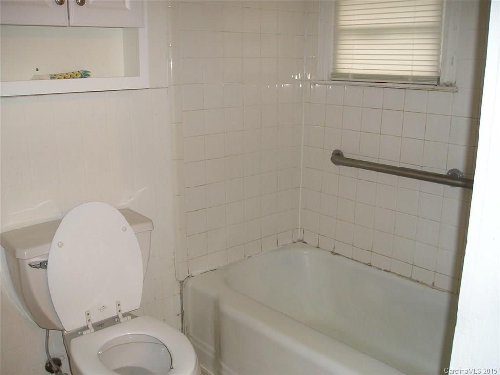 4904 Morgan Mill Road Monroe, NC 28110 - Photo 16 of 24 a bathroom with a toilet and a shower