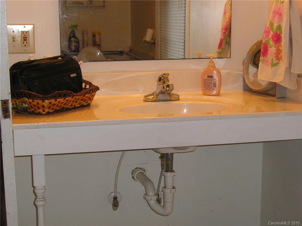 4904 Morgan Mill Road Monroe, NC 28110 - Photo 19 of 24 a bathroom with a sink and a mirror