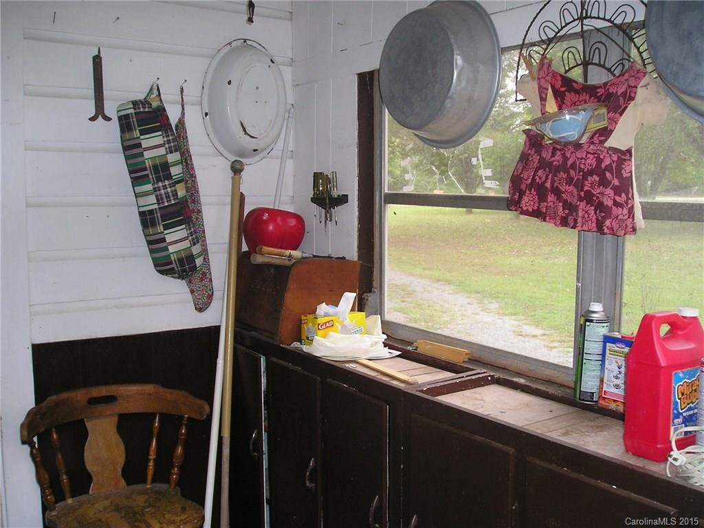 4904 Morgan Mill Road Monroe, NC 28110 - Photo 20 of 24 a bathroom with a sink a mirror and painting on the wall