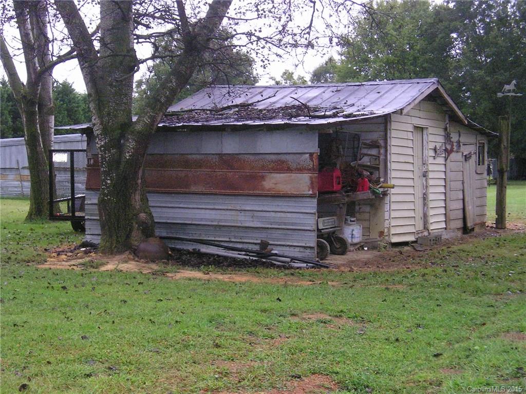 4904 Morgan Mill Road Monroe, NC 28110 - Photo 21 of 24 a front view of a house with a garden
