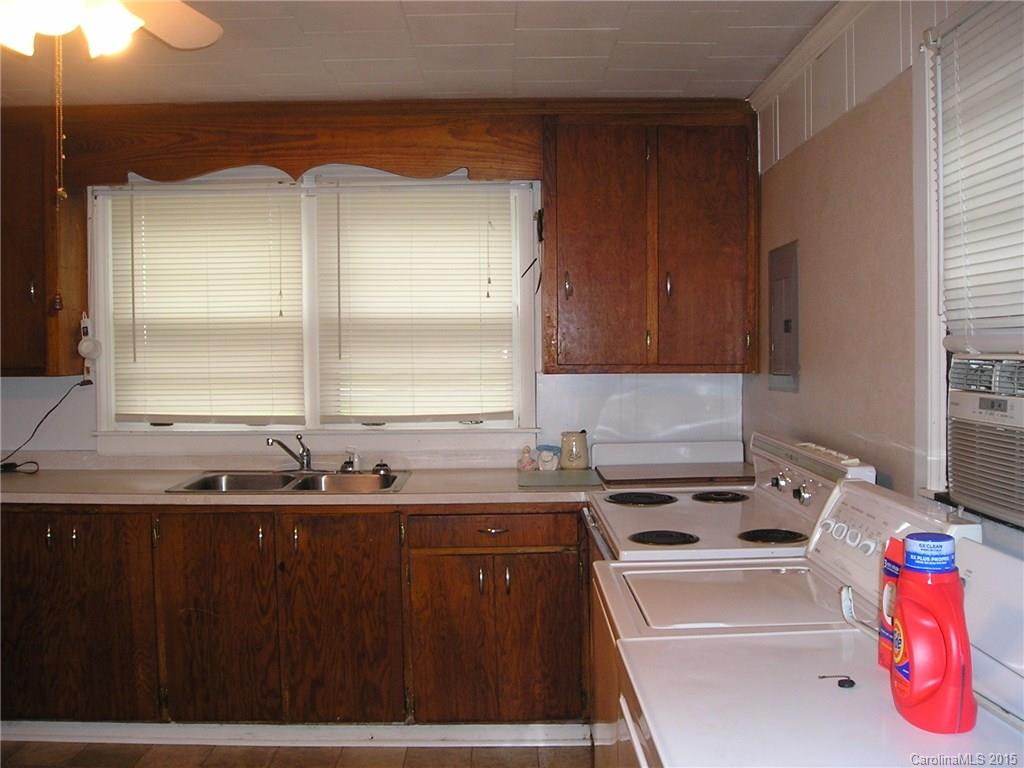 4904 Morgan Mill Road Monroe, NC 28110 - Photo 5 of 24 a kitchen with a sink and a stove