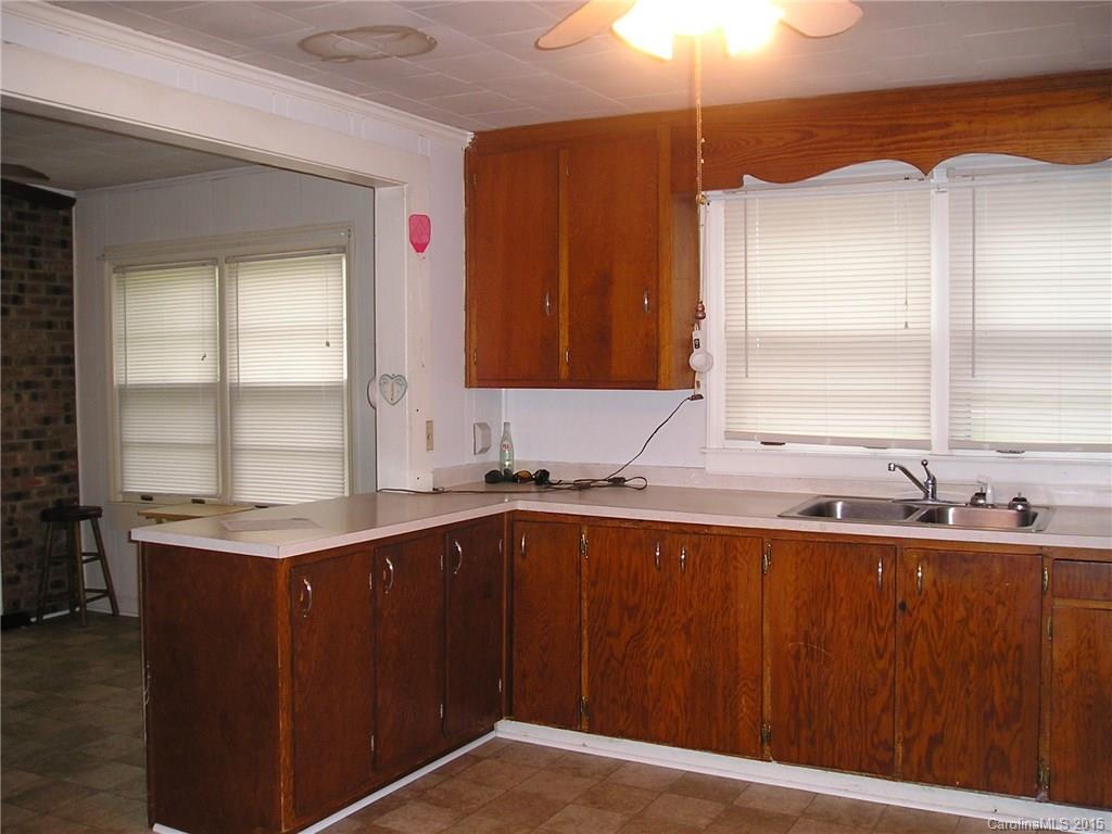 4904 Morgan Mill Road Monroe, NC 28110 - Photo 6 of 24 a kitchen with a sink a window and cabinets