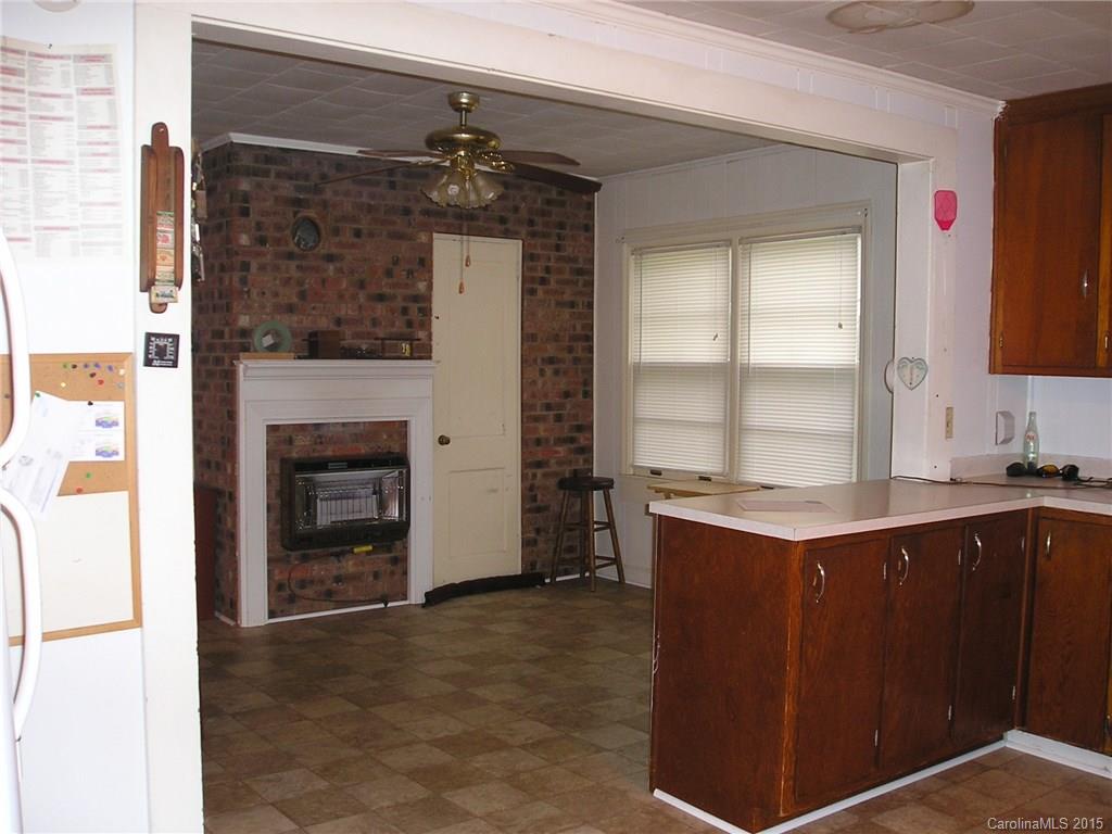 4904 Morgan Mill Road Monroe, NC 28110 - Photo 7 of 24 a kitchen with a sink stove and cabinets