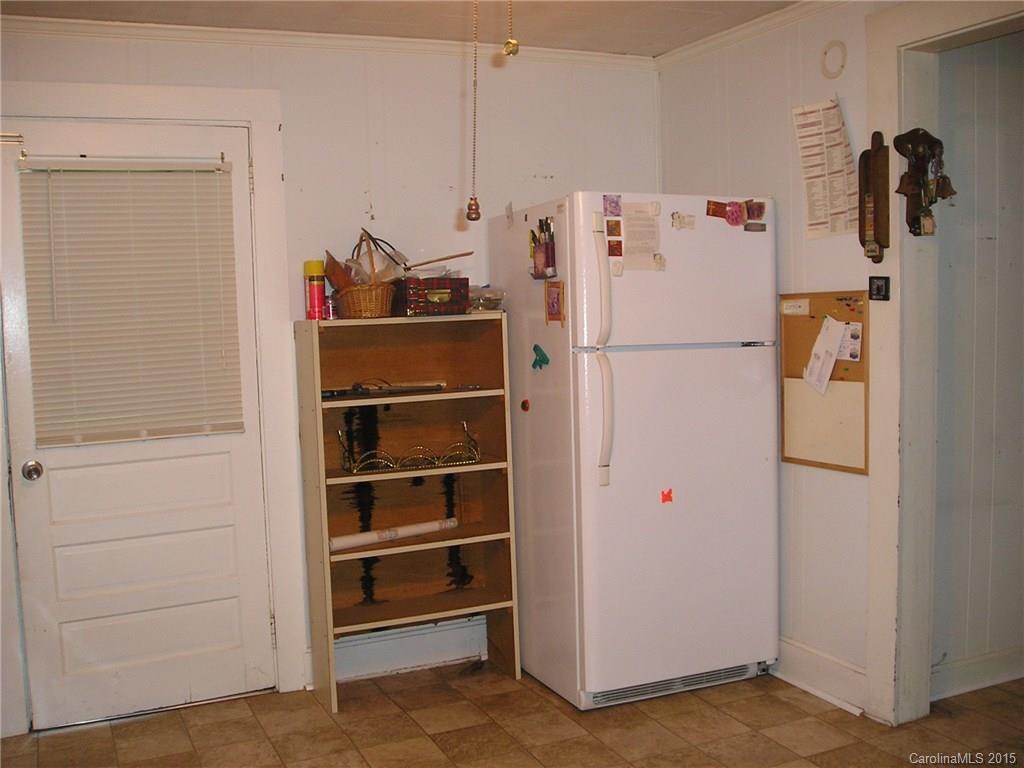 4904 Morgan Mill Road Monroe, NC 28110 - Photo 8 of 24 a white refrigerator freezer sitting inside of a kitchen