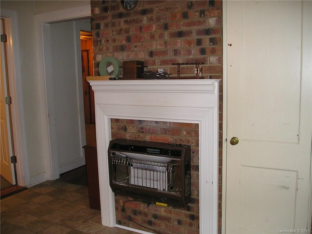 4904 Morgan Mill Road Monroe, NC 28110 - Photo 9 of 24 a living room with a fireplace