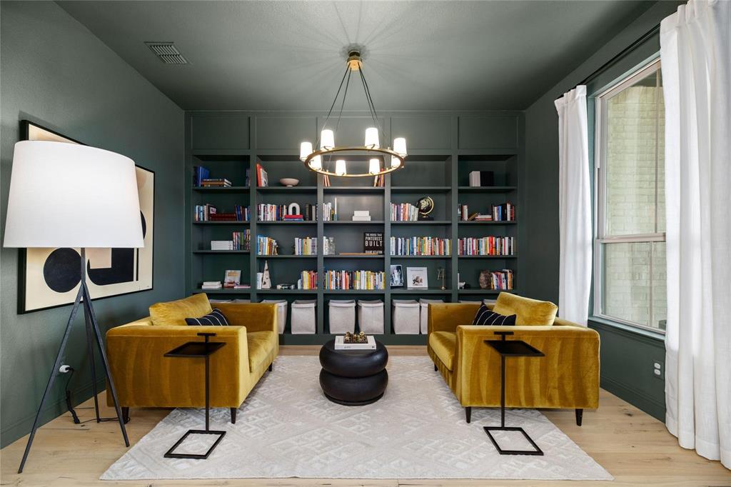 2262 Poppyvine Road Frisco, TX 75033 - Photo 13 of 40 Built-in shelving, wood-finish flooring, recessed lighting, and a window with white drapes