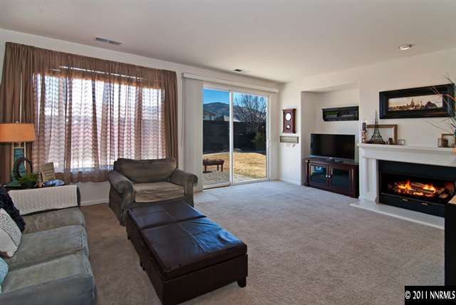 475 Cicada Court Reno, NV 89521 - Photo 3 of 13 a living room with furniture and a fireplace