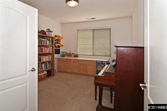 475 Cicada Court Reno, NV 89521 - Photo 7 of 13 a view of a workspace with furniture and a window