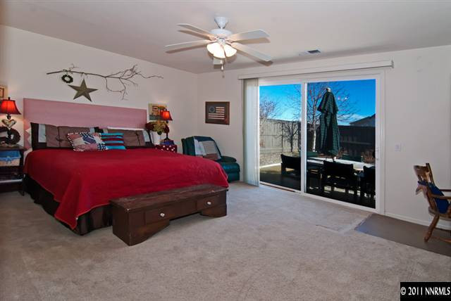475 Cicada Court Reno, NV 89521 - Photo 8 of 13 a bedroom with a bed and a tv