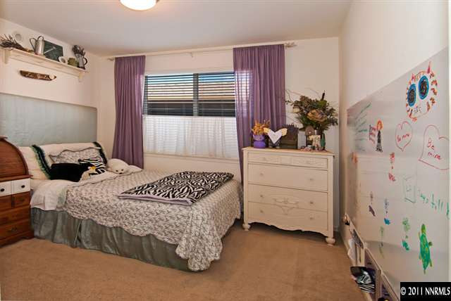475 Cicada Court Reno, NV 89521 - Photo 10 of 13 a bedroom with a bed and a dresser