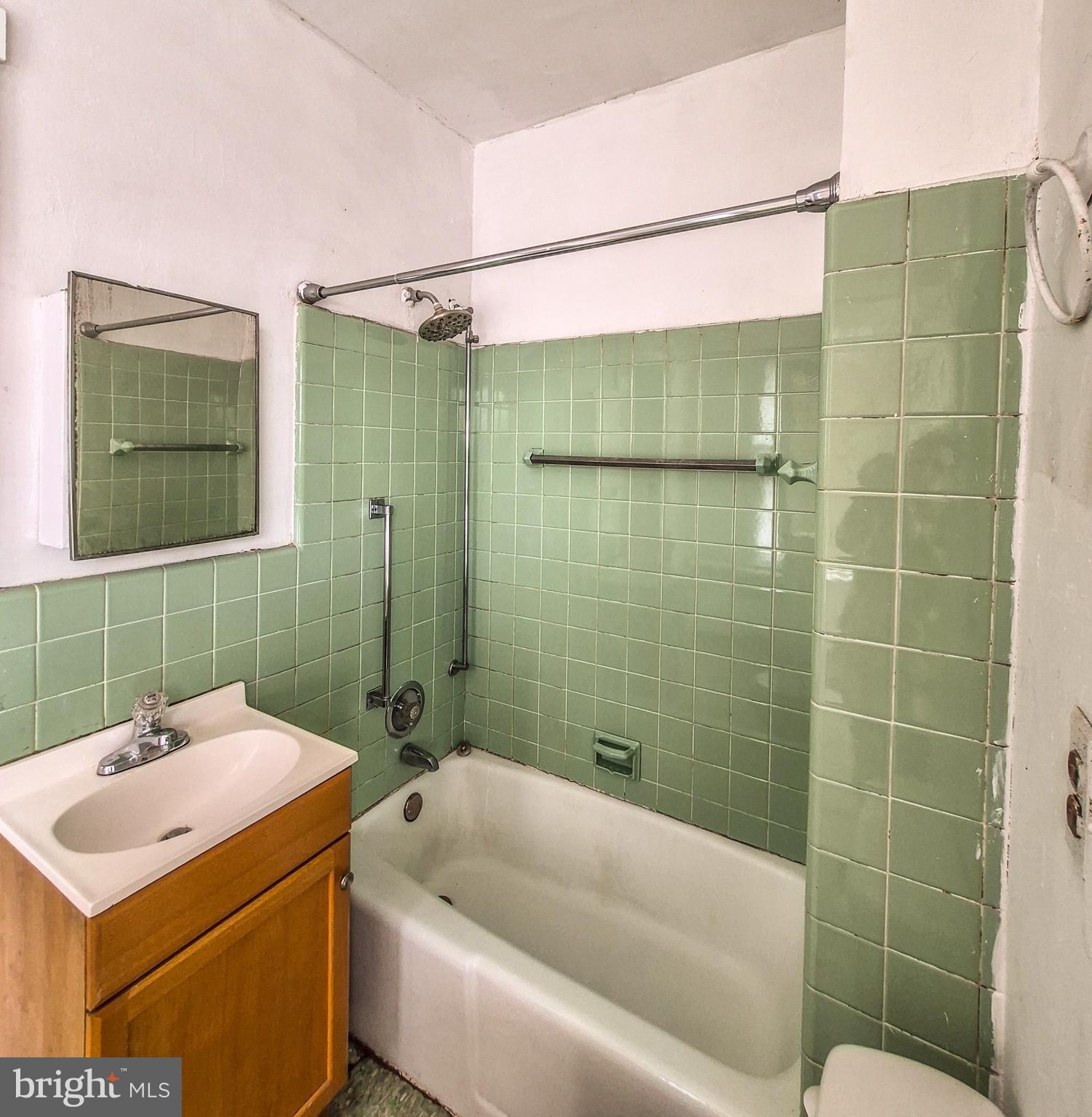 1262 Buttonwood Street Reading, PA 19604 - Photo 17 of 22 a bathroom with a sink and mirror
