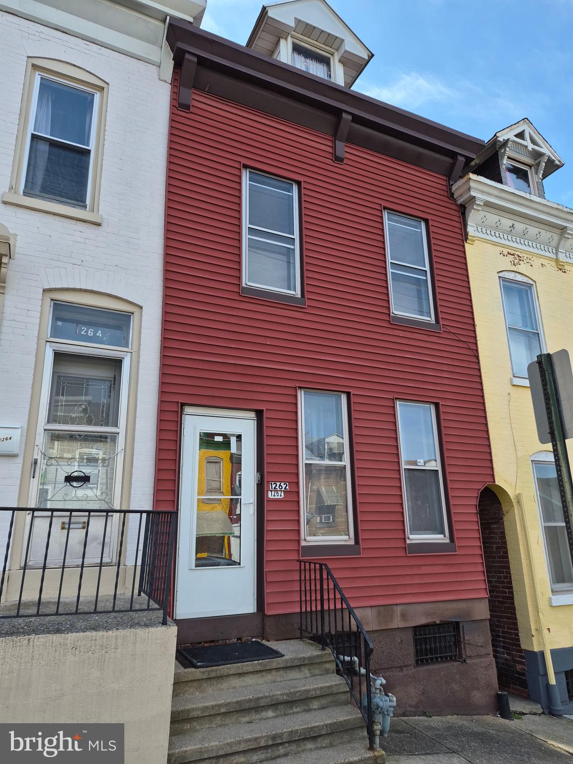 1262 Buttonwood Street Reading, PA 19604 - Photo 2 of 22 a view of a brick building with many windows