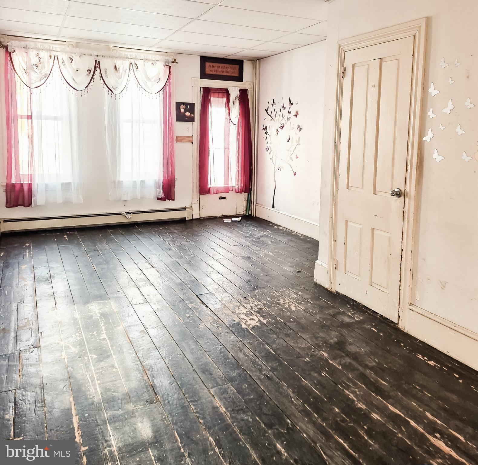 1262 Buttonwood Street Reading, PA 19604 - Photo 3 of 22 a view of a closet area with wooden floor