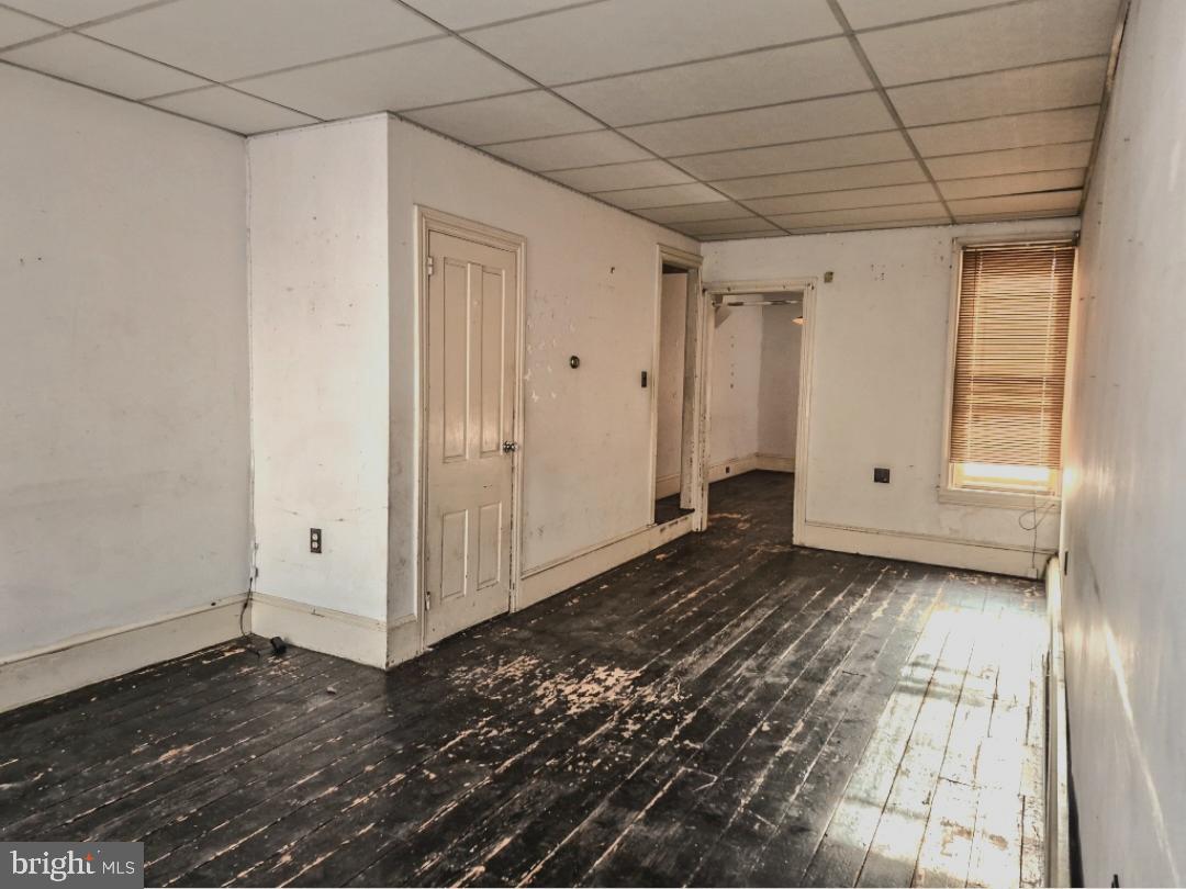 1262 Buttonwood Street Reading, PA 19604 - Photo 5 of 22 a view of a livingroom with an empty space and wooden floor