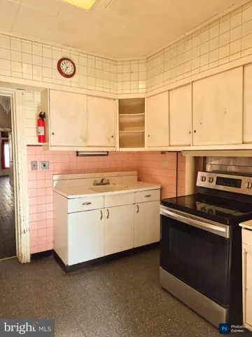 a kitchen with a stove and a sink