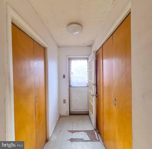 a view of a hallway with a bathroom