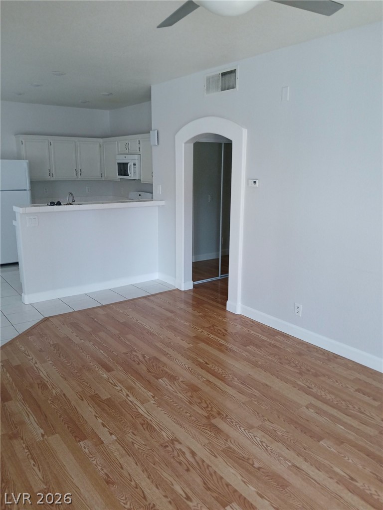 2201 Ramsgate Drive, Unit 426 Henderson, NV 89074 - Photo 20 of 22 This bright and airy living space seamlessly connects to the kitchen, featuring durable flooring.