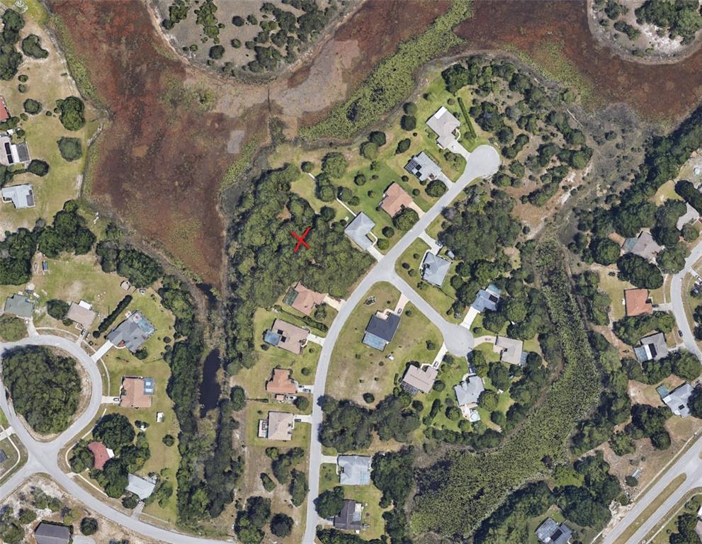 4153 Valley Brook Court Spring Hill, FL 34606 - Photo 2 of 3 view of a multi story building