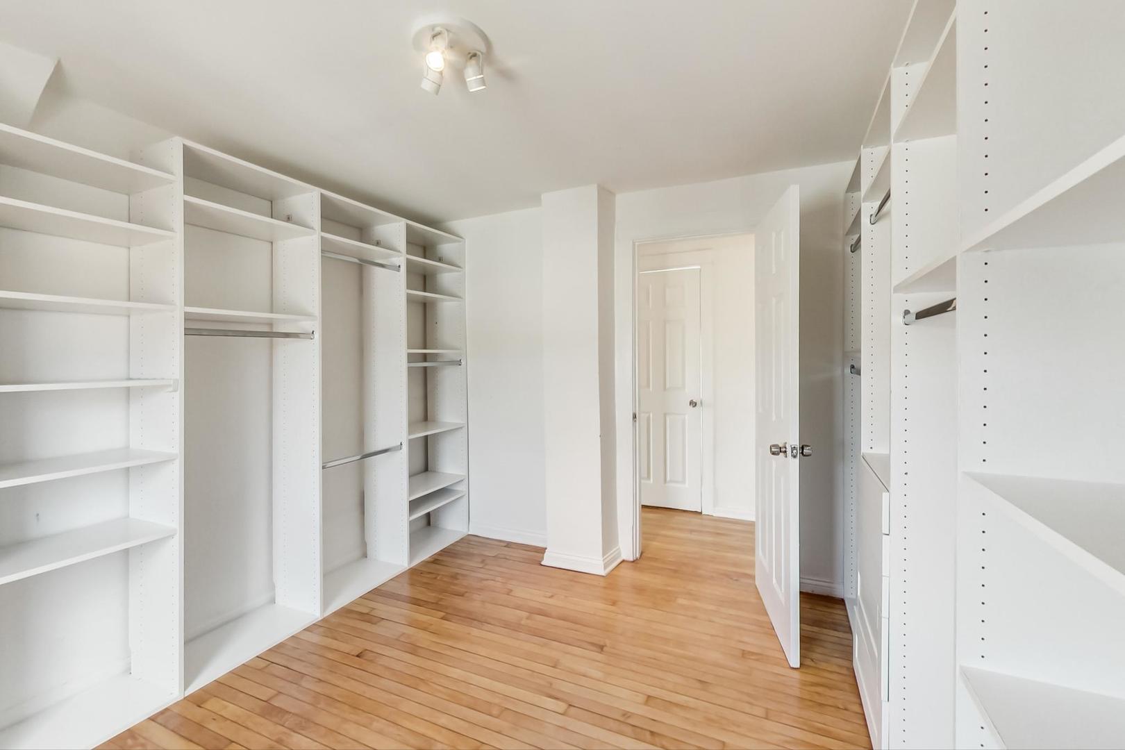 4015 West Addison Street Chicago, IL 60641 - Photo 16 of 30 a view of empty room with wooden floor and entryway