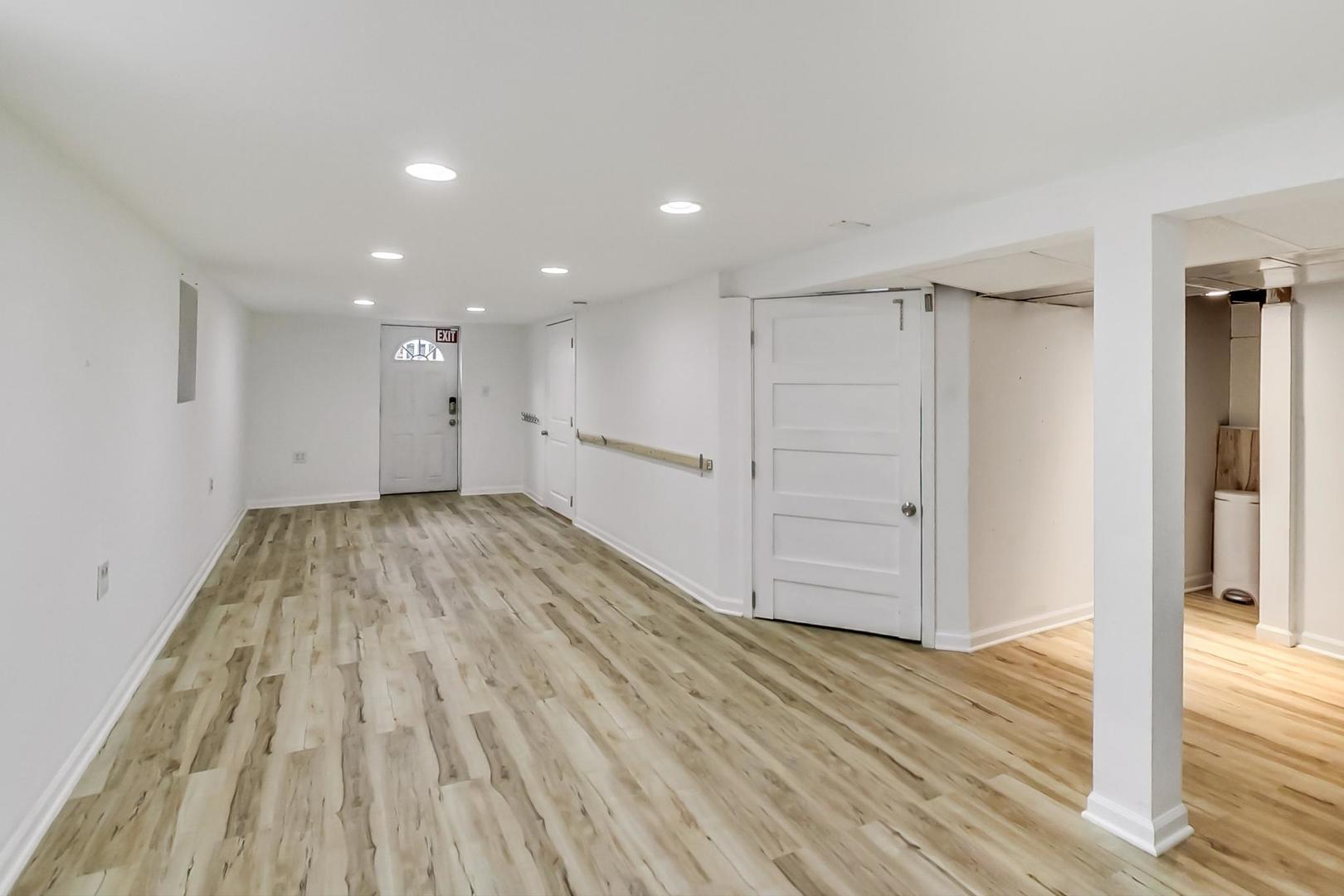 4015 West Addison Street Chicago, IL 60641 - Photo 18 of 30 a view of hallway with wooden floor