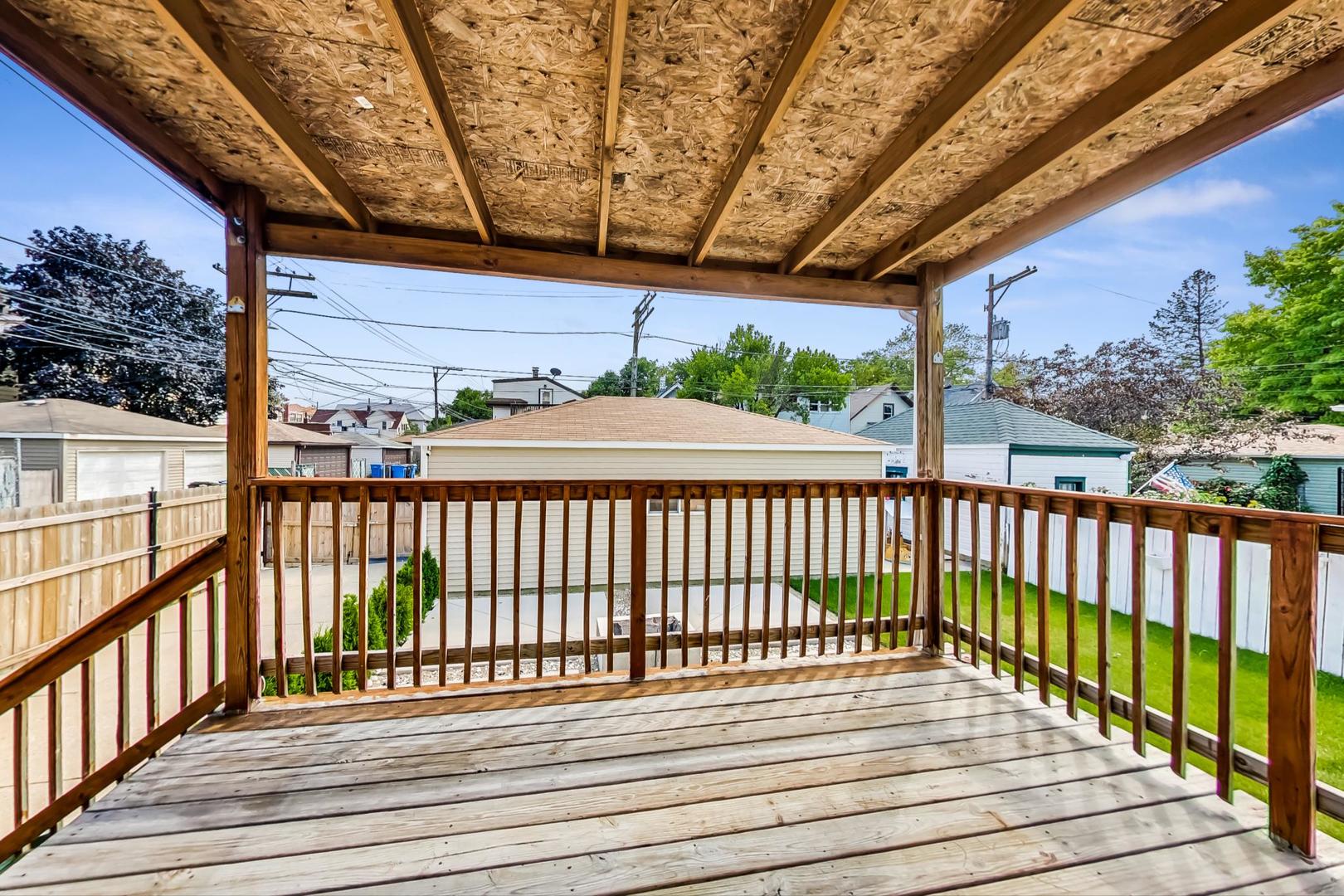 4015 West Addison Street Chicago, IL 60641 - Photo 22 of 30 a view of balcony with wooden floor