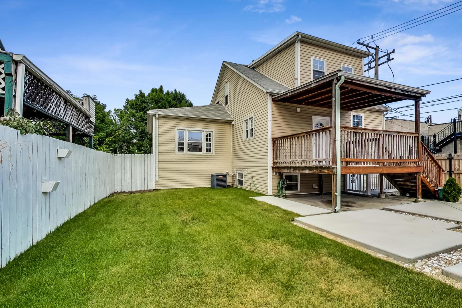 4015 West Addison Street Chicago, IL 60641 - Photo 25 of 30 a view of house with yard and entertaining space