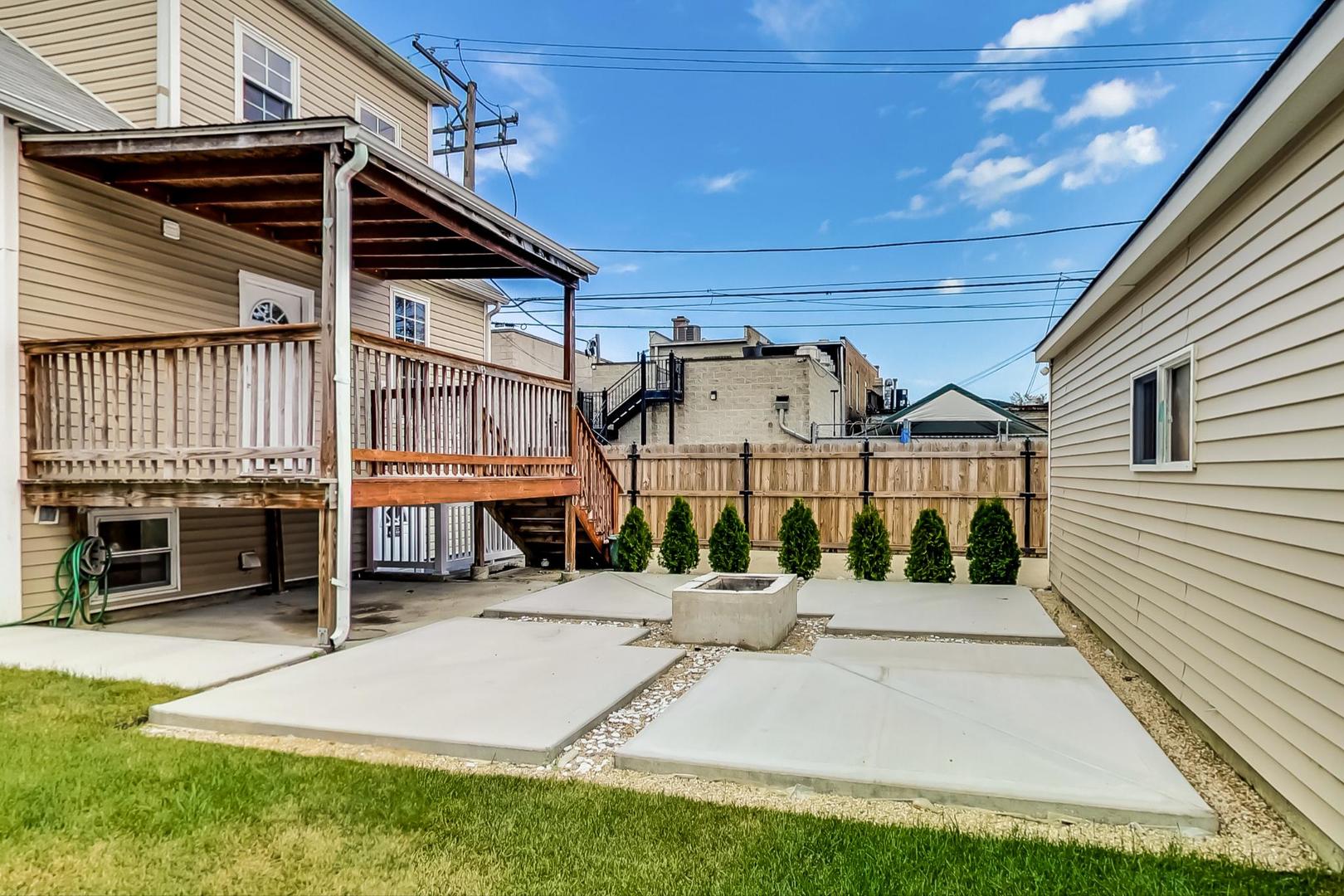 4015 West Addison Street Chicago, IL 60641 - Photo 26 of 30 a view of a house with a patio
