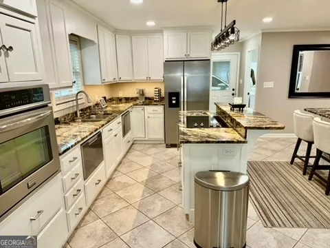 a spacious bedroom with a bed and a large mirror