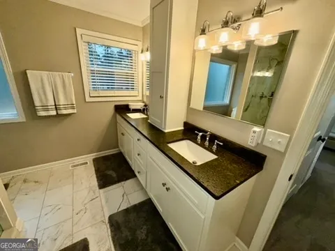 a bedroom with a bed and a cabinets