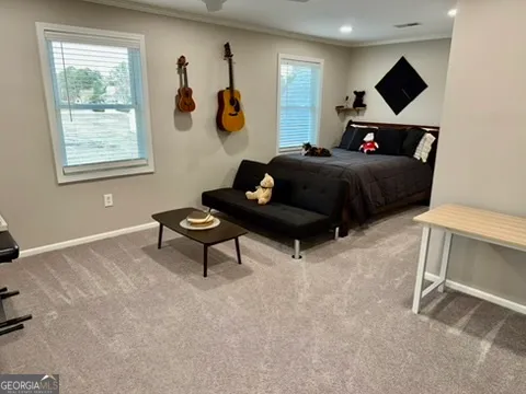 a living room with furniture and a rug