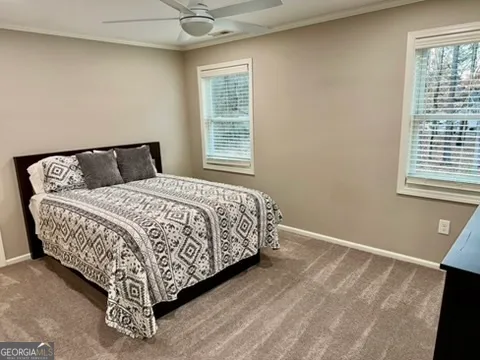 a bathroom with a granite countertop shower a sink and a mirror
